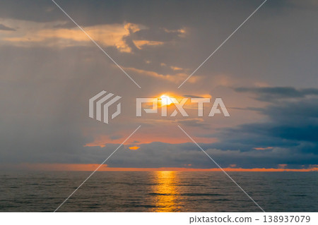 View of amazing dramatic sunset over the Black Sea surface in the evening View of amazing dramatic sunset over the Black Sea surface in the evening 138937079