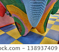 The hanging part is a colorful knitted play maze in the children's room of a supermarket 138937409