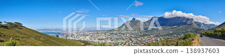 Mountain landscape and panorama view of coastal city, residential buildings or infrastructure in famous travel or tourism destination. Copy space and scenic blue sky of Table Mountain in South Africa 138937603