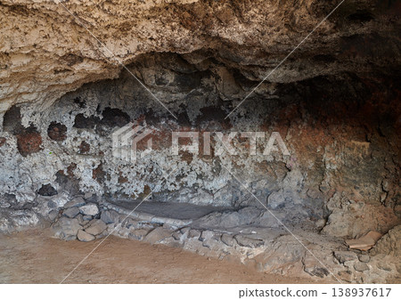 Abandoned old cave and secret underground tunnel formed from molten lava and igneous rock after a volcanic eruption in Los Llanos, La Palma, Spain. Ancient ruins with hidden stone chamber and cavern Abandoned old cave and secret underground tunnel formed from molten lava and igneous rock after a volcanic eruption in Los Llanos, La Palma, Spain. Ancient ruins with hidden stone chamber and cavern 138937617