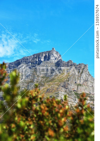 Landscape of a mountain and plants against a blue sky with copy space. A popular travel destination for tourists and hikers to explore. Relaxing view of Table Mountain in Cape Town, Western Cape 138937674