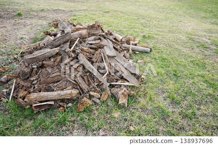 chopped wood in a garden of my friend, old rotten logs for a garden bed, copy space chopped wood in a garden of my friend, old rotten logs for a garden bed, copy space 138937696