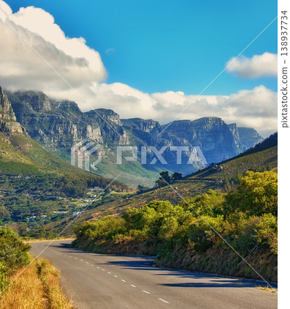 Copy space with a mountain pass along the Twelve Apostles in Cape Town, South Africa against a cloudy sky background over a peninsula. Calm and scenic landscape to travel or explore on a road trip 138937734