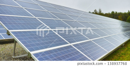 Sun energy. Solar power station in Denmark. Photovoltaic solar cell panels as renewable energy source. Blue solar panels generating electricity in solar power station, alternative energy from nature. Sun energy. Solar power station in Denmark. Photovoltaic solar cell panels as renewable energy source. Blue solar panels generating electricity in solar power station, alternative energy from nature. 138937768