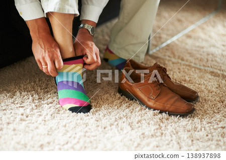 Man getting ready, shoes and socks on carpet in home, putting on business fashion and start to day. Businessman dressing for work in morning, feet on floor with style and wardrobe for office career. Man getting ready, shoes and socks on carpet in home, putting on business fashion and start to day. Businessman dressing for work in morning, feet on floor with style and wardrobe for office career. 138937898