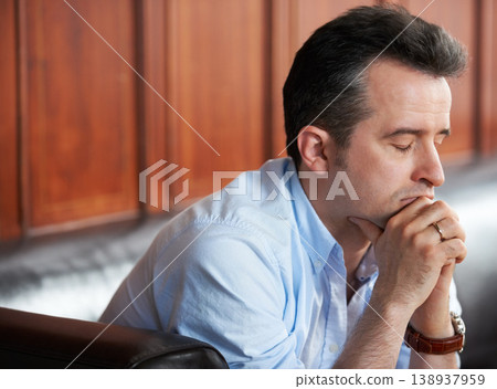 Man, praying and thinking with stress on sofa in waiting room for interview, recruitment or loss of job. Businessman, anxiety or sitting on couch with fear of unemployment, failure or problem at work Man, praying and thinking with stress on sofa in waiting room for interview, recruitment or loss of job. Businessman, anxiety or sitting on couch with fear of unemployment, failure or problem at work 138937959