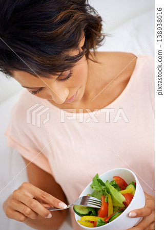 Food, health and young woman with a salad at home with vegetables for wellness, organic or diet. Top view, nutrition and female person from Mexico eating healthy meal with produce in living room. Food, health and young woman with a salad at home with vegetables for wellness, organic or diet. Top view, nutrition and female person from Mexico eating healthy meal with produce in living room. 138938016