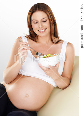 Relax, salad and pregnant with woman, smile and healthy food on a white studio background. Person, bowl and model with happiness, wellness or pregnancy with vegetables, vitamins or maternal with meal Relax, salad and pregnant with woman, smile and healthy food on a white studio background. Person, bowl and model with happiness, wellness or pregnancy with vegetables, vitamins or maternal with meal 138938109