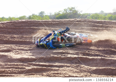 Sand, accident and motorbike for sports with action for challenge or competition with power. Speed, mistake and desert with bike for race or adventure in outdoor with freedom or fearless driving. Sand, accident and motorbike for sports with action for challenge or competition with power. Speed, mistake and desert with bike for race or adventure in outdoor with freedom or fearless driving. 138938214