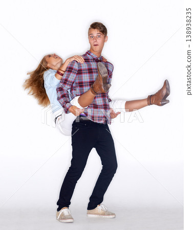 Portrait, funny couple and piggyback in studio isolated on a white background mockup space. Excited, happy man carrying woman and ride, play and smile together for love, bonding and laugh for freedom Portrait, funny couple and piggyback in studio isolated on a white background mockup space. Excited, happy man carrying woman and ride, play and smile together for love, bonding and laugh for freedom 138938235