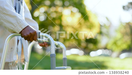 Hands, walking frame and an elderly person in a garden outdoor in summer closeup during retirement. Wellness, rehabilitation or recovery and a senior adult with a disability in the park for peace Hands, walking frame and an elderly person in a garden outdoor in summer closeup during retirement. Wellness, rehabilitation or recovery and a senior adult with a disability in the park for peace 138938240