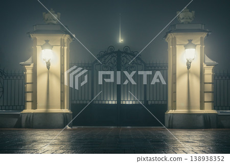 The main gate and fence of the Mariinsky Palace on a foggy winter night. Mariinsky Palace is the official ceremonial residence of the President of Ukraine in Kyiv. Ukraine The main gate and fence of the Mariinsky Palace on a foggy winter night. Mariinsky Palace is the official ceremonial residence of the President of Ukraine in Kyiv. Ukraine 138938352