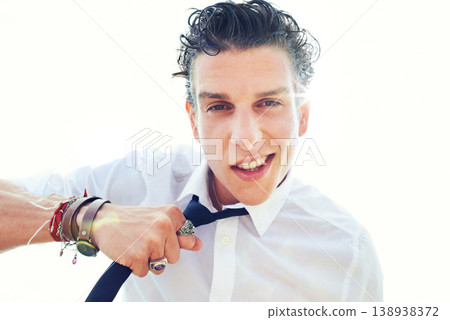 Portrait, man and energy with necktie, smile and punk isolated on a white studio background. Face, person and model with jewelry, fashion and stylish clothes with edgy outfit, trendy and fun Portrait, man and energy with necktie, smile and punk isolated on a white studio background. Face, person and model with jewelry, fashion and stylish clothes with edgy outfit, trendy and fun 138938372