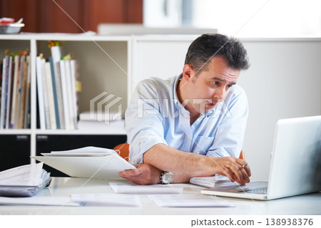 Business man, laptop and documents with reading, scroll and thinking with finance review, budget or audit. Accountant, computer and paperwork for financial compliance in office, process and solution Business man, laptop and documents with reading, scroll and thinking with finance review, budget or audit. Accountant, computer and paperwork for financial compliance in office, process and solution 138938376