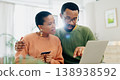 Payment, credit card and a black couple with a laptop for online shopping, banking or search on website. Ecommerce, house and an African man and woman reading information to pay from an email 138938592