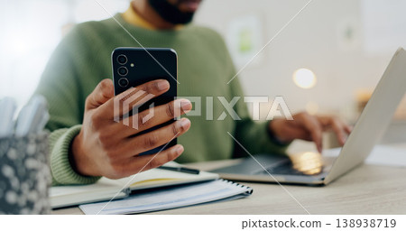 Phone, laptop and hands multitask or typing for work, online and man with project notebook on desk. Cellphone, app and businessman check information, email or research notes on internet and computer 138938719