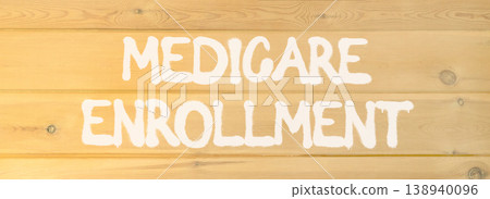 Medicare enrollment words symbol. Concept words Medicare enrollment on beautiful wooden wall. Beautiful wooden wall background. Medical and Medicare enrollment words concept. Copy space. 138940096