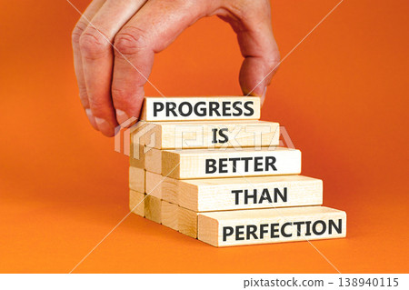 Progress or perfection words symbol. Concept words Progress is better than perfection on beautiful wooden blocks. Beautiful orange paper background. Business progress or perfection concept. Copy space Progress or perfection words symbol. Concept words Progress is better than perfection on beautiful wooden blocks. Beautiful orange paper background. Business progress or perfection concept. Copy space 138940115