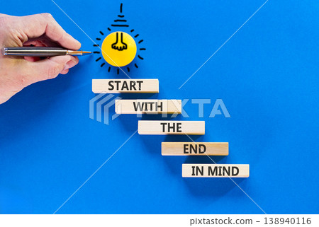 Start with the end in mind symbol. Concept words Start with the end in mind on beautiful wooden blocks. Beautiful blue paper background. Business start with the end in mind concept. Copy space. 138940116