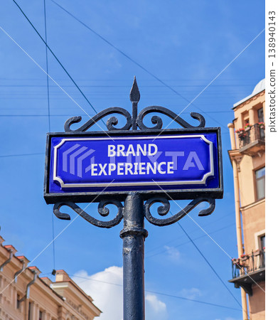 Brand experience symbol. Concept words Brand experience on beautiful big blue road sign. Beautiful blue sky and buildings background. Business branding and brand experience concept. Copy space. 138940143