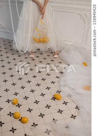 Bride With Citrus. Elegant Bride Holding Lemons. Minimalist Bride Surrounded By Citrus And Pearls Bride With Citrus. Elegant Bride Holding Lemons. Minimalist Bride Surrounded By Citrus And Pearls 138940428