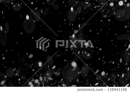 A dreamy, snow-like bokeh effect against a black background. A dreamy, snow-like bokeh effect against a black background. 138941196