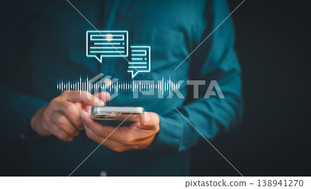 Person using smartphone with voice recognition and AI chatbot messaging technology. Digital communication assistant with sound wave graphic for mobile audio text interface. Person using smartphone with voice recognition and AI chatbot messaging technology. Digital communication assistant with sound wave graphic for mobile audio text interface. 138941270