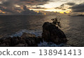 Solitary rock with palm trees amidst ocean waves at sunset. Seychelles, Mahe. 138941413
