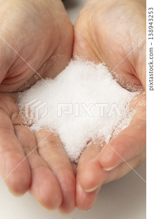 Salt placed in the palm of your hand Salt placed in the palm of your hand 138943253