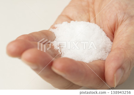 Salt placed in the palm of your hand 138943256