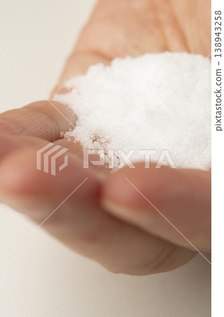 Salt placed in the palm of your hand Salt placed in the palm of your hand 138943258