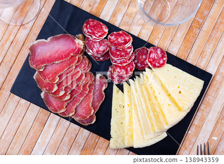 Served sliced sausage, cheese and ham Served sliced sausage, cheese and ham 138943359