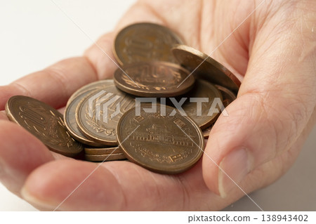 Coins placed in the palm of your hand Coins placed in the palm of your hand 138943402