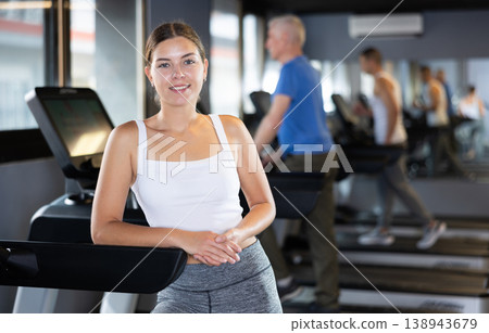 Girl walk on treadmill in gym. Healthy lifestyle, extensive training 138943679