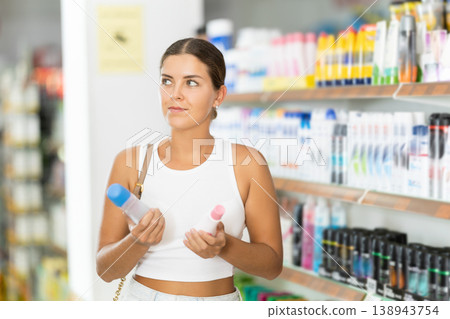 Young woman choosing cosmetics in store Young woman choosing cosmetics in store 138943754