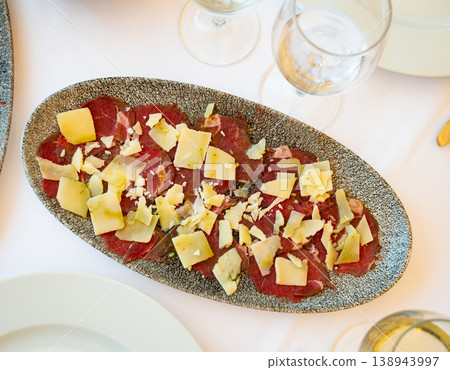 Beef carpaccio with grated cheese served on plate Beef carpaccio with grated cheese served on plate 138943997