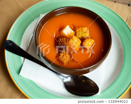 Creamy carrot soup garnished with crispy toasted bread Creamy carrot soup garnished with crispy toasted bread 138944022
