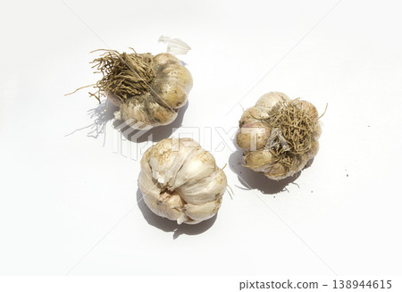 Garlic on a white background. Garlic on a white background. 138944615
