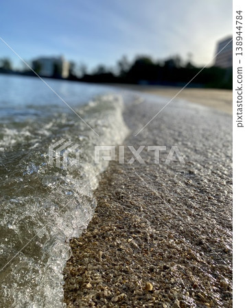 The sea of Okinawa: waves lapping against the shore and the scenery of the sandy beach - summer nature The sea of Okinawa: waves lapping against the shore and the scenery of the sandy beach - summer nature 138944784
