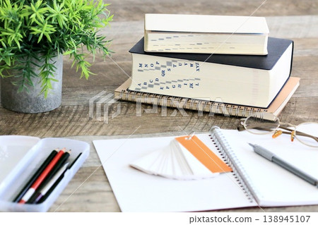A calm study space for learning with dictionaries and notebooks. A calm study space for learning with dictionaries and notebooks. 138945107