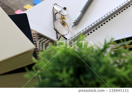 A desk environment for studying with textbooks and notebooks A desk environment for studying with textbooks and notebooks 138945131