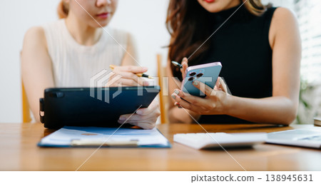 Team business meeting presentation. Hand businessman working project in modern office.Laptop computer and tablet and smart phone 138945631