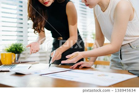 Team business meeting presentation. Hand businessman working project in modern office.Laptop computer and tablet and smart phone Team business meeting presentation. Hand businessman working project in modern office.Laptop computer and tablet and smart phone 138945634