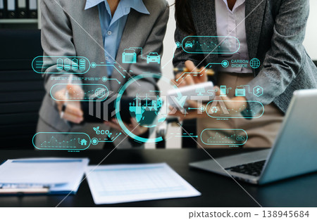 Business team working virtual modern smartphone to reduce CO2 emissions carbon footprint climate change to limit global warming.Sustainable development and green business concep Business team working virtual modern smartphone to reduce CO2 emissions carbon footprint climate change to limit global warming.Sustainable development and green business concep 138945684
