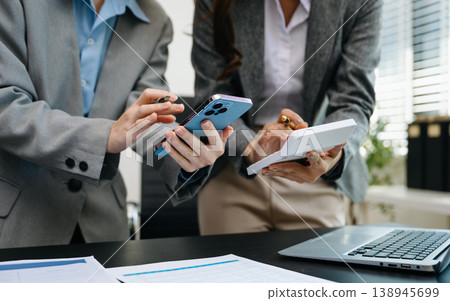 Team business meeting presentation. Hand businessman working project in modern office.Laptop computer and tablet and smart phone on white desk 138945699