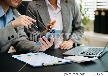 Team business meeting presentation. Hand businessman working project in modern office.Laptop computer and tablet and smart phone Team business meeting presentation. Hand businessman working project in modern office.Laptop computer and tablet and smart phone 138945720