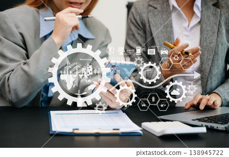 Business team working virtual modern smartphone to reduce CO2 emissions carbon footprint climate change to limit global warming.Sustainable development and green business concept. at office 138945722