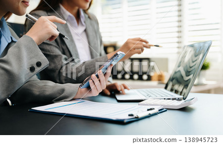 Team business meeting presentation. Hand businessman working project in modern office.Laptop computer and tablet and smart phone 138945723