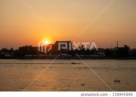 Sunset sky with the silhouette of riverside building Sunset sky with the silhouette of riverside building 138945890