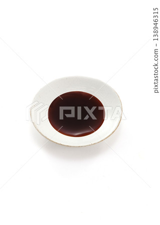 Soy sauce poured into a plate 138946315